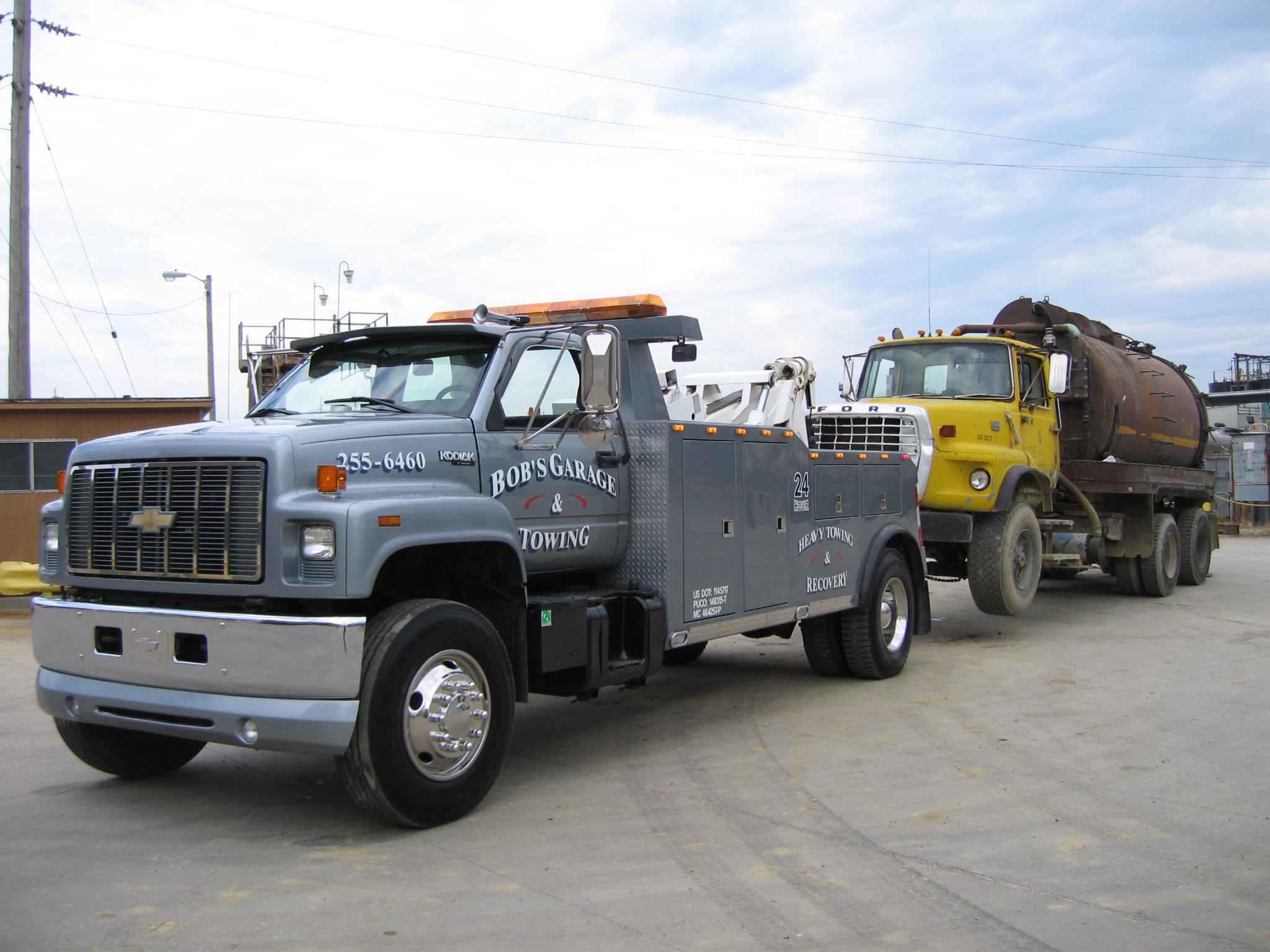 Our Heavy-Duty truck towing a tandem septic truck